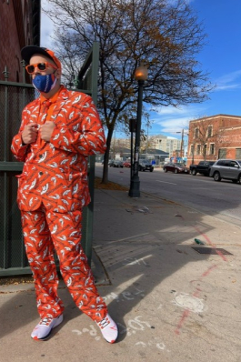 Mike posing in a bright suit in Denver.