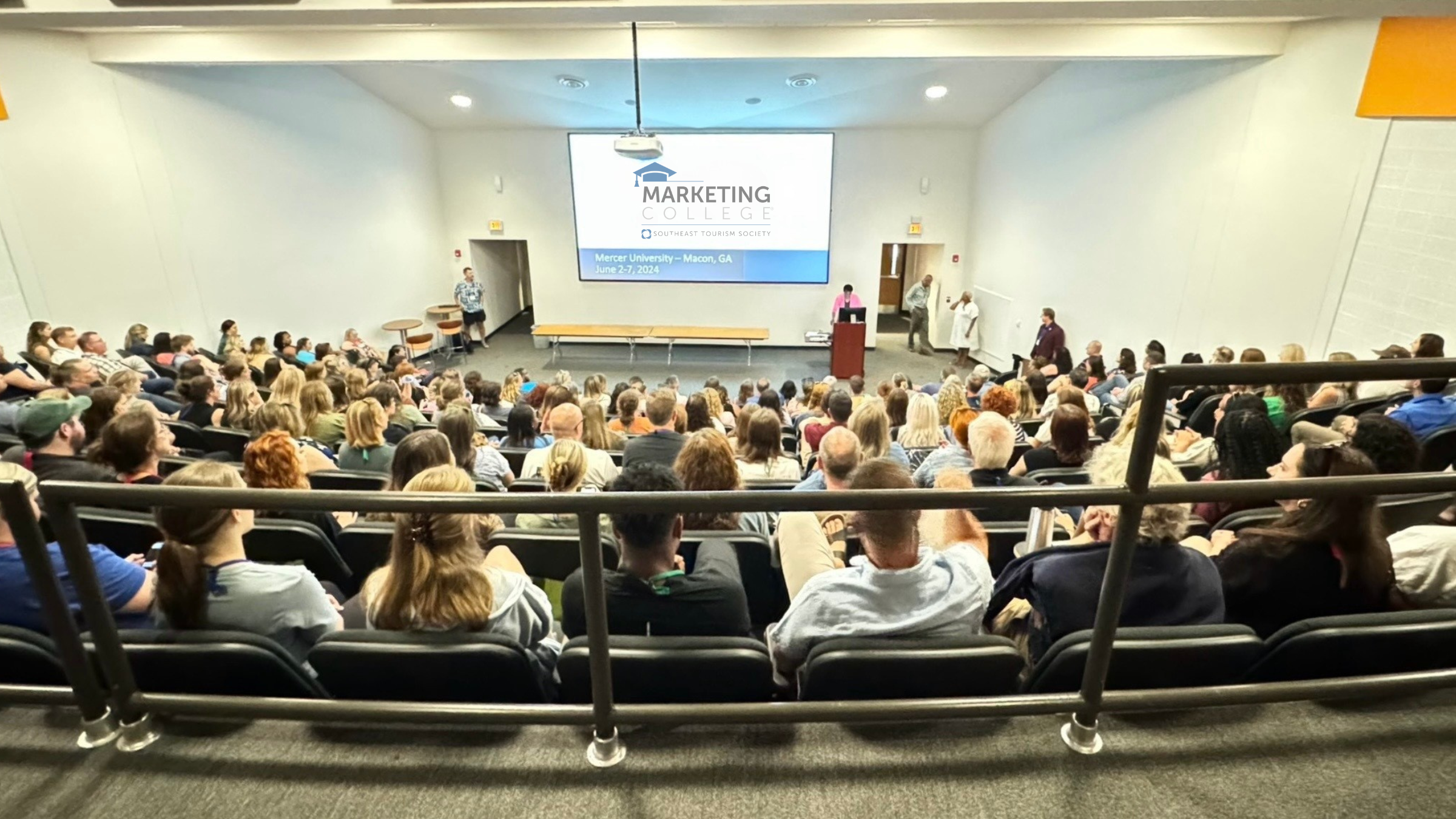 a group of people in a lecture hall