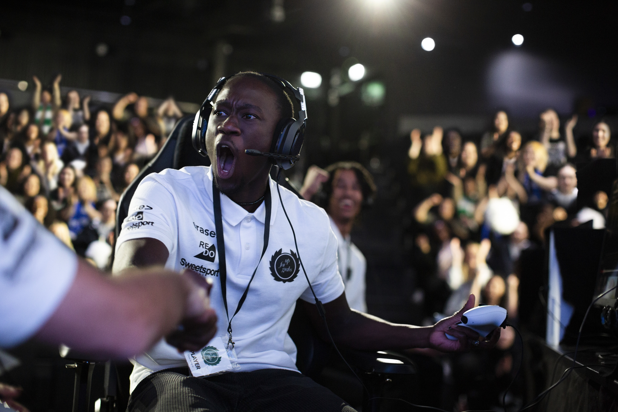 A esports player celebrating a win.