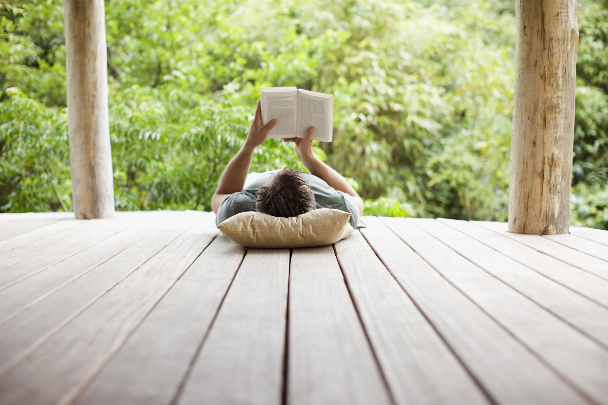 Person reading on a porch