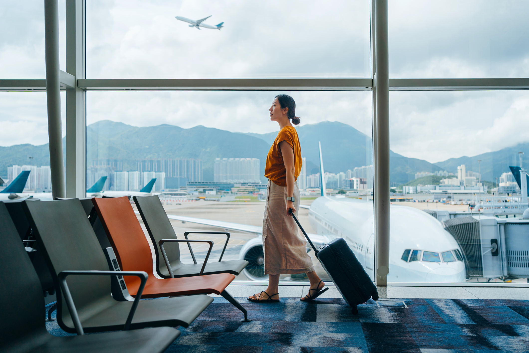 A photo of a traveler in an airport. 