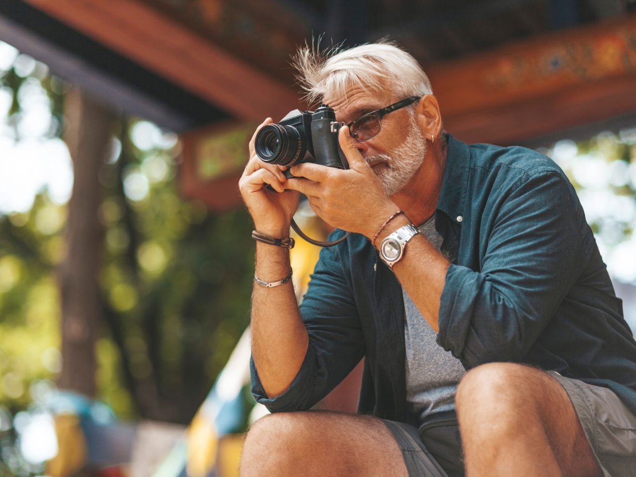 A senior traveler taking a photo. 