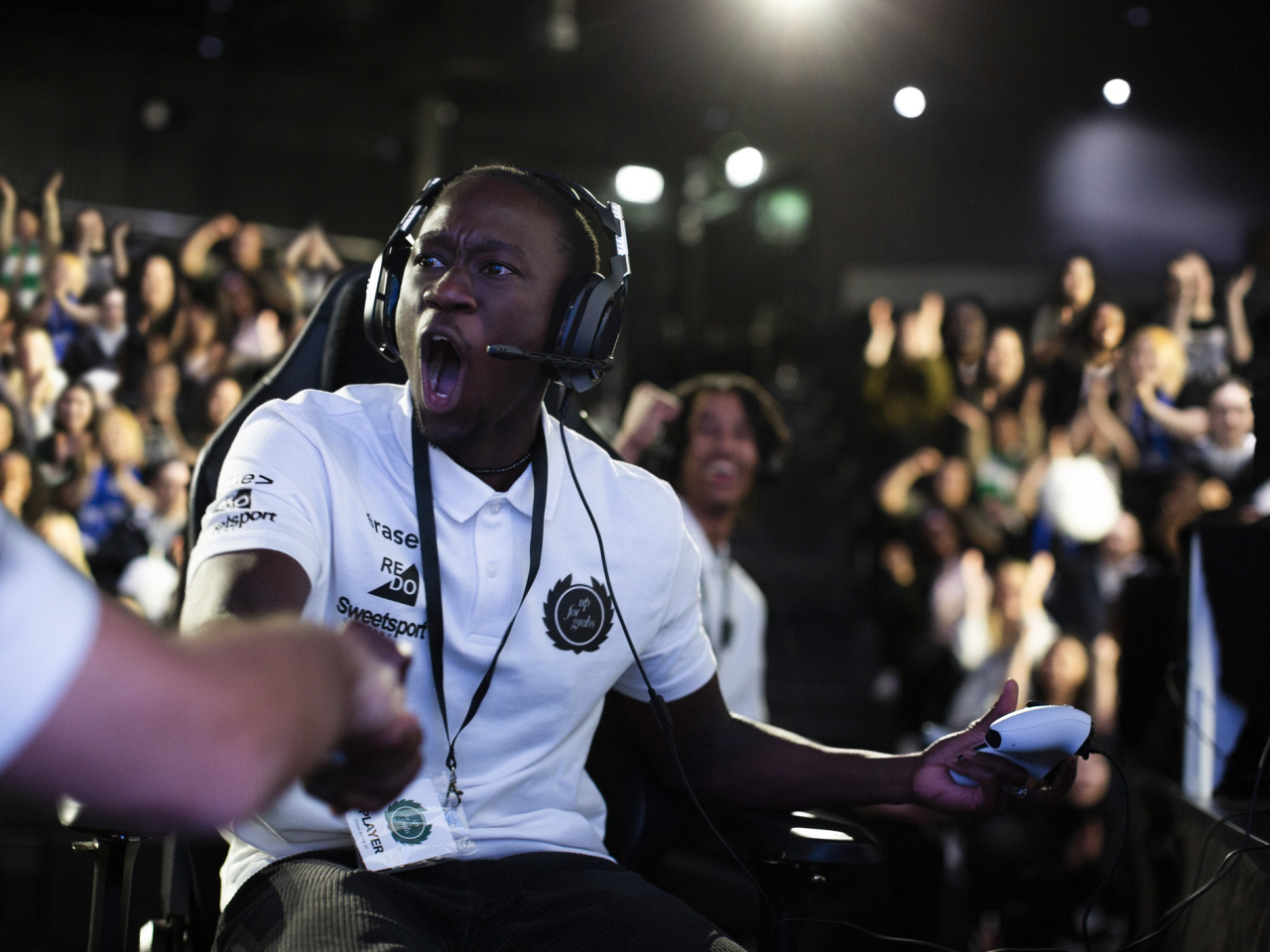A esports player celebrating a win.