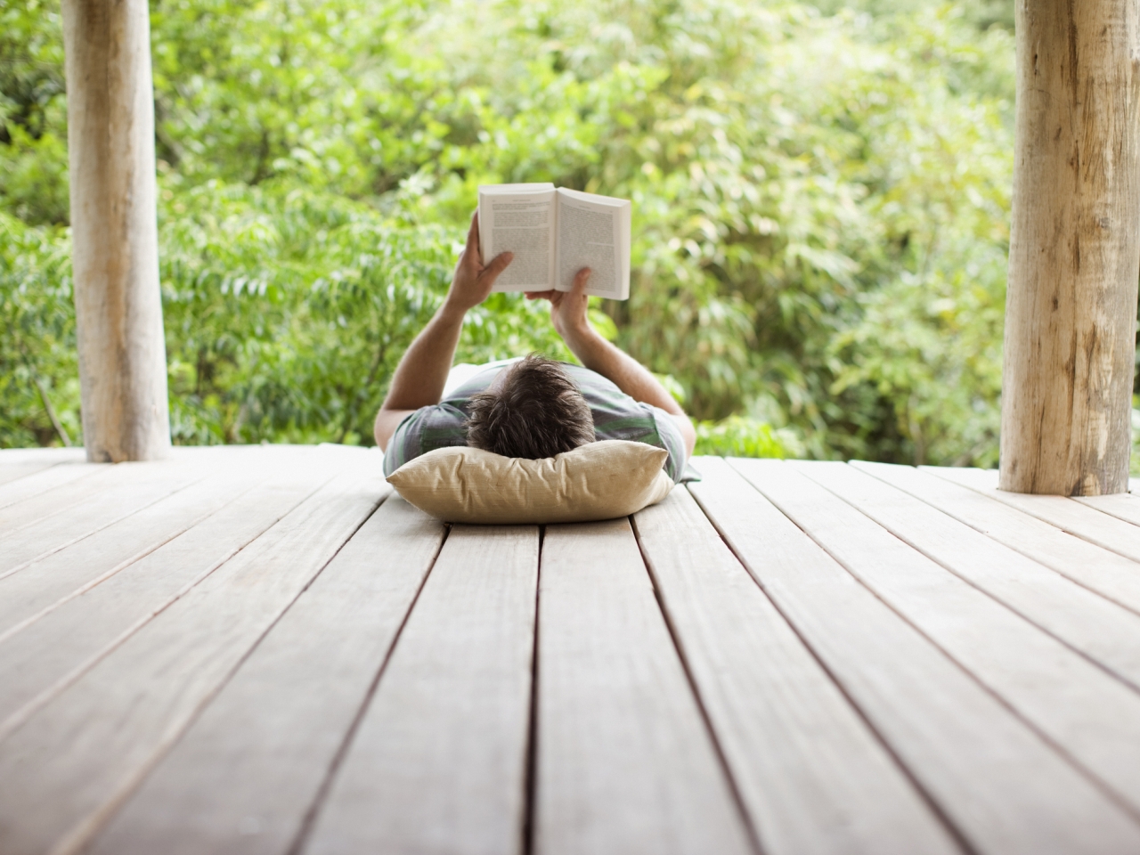 Person reading on a porch