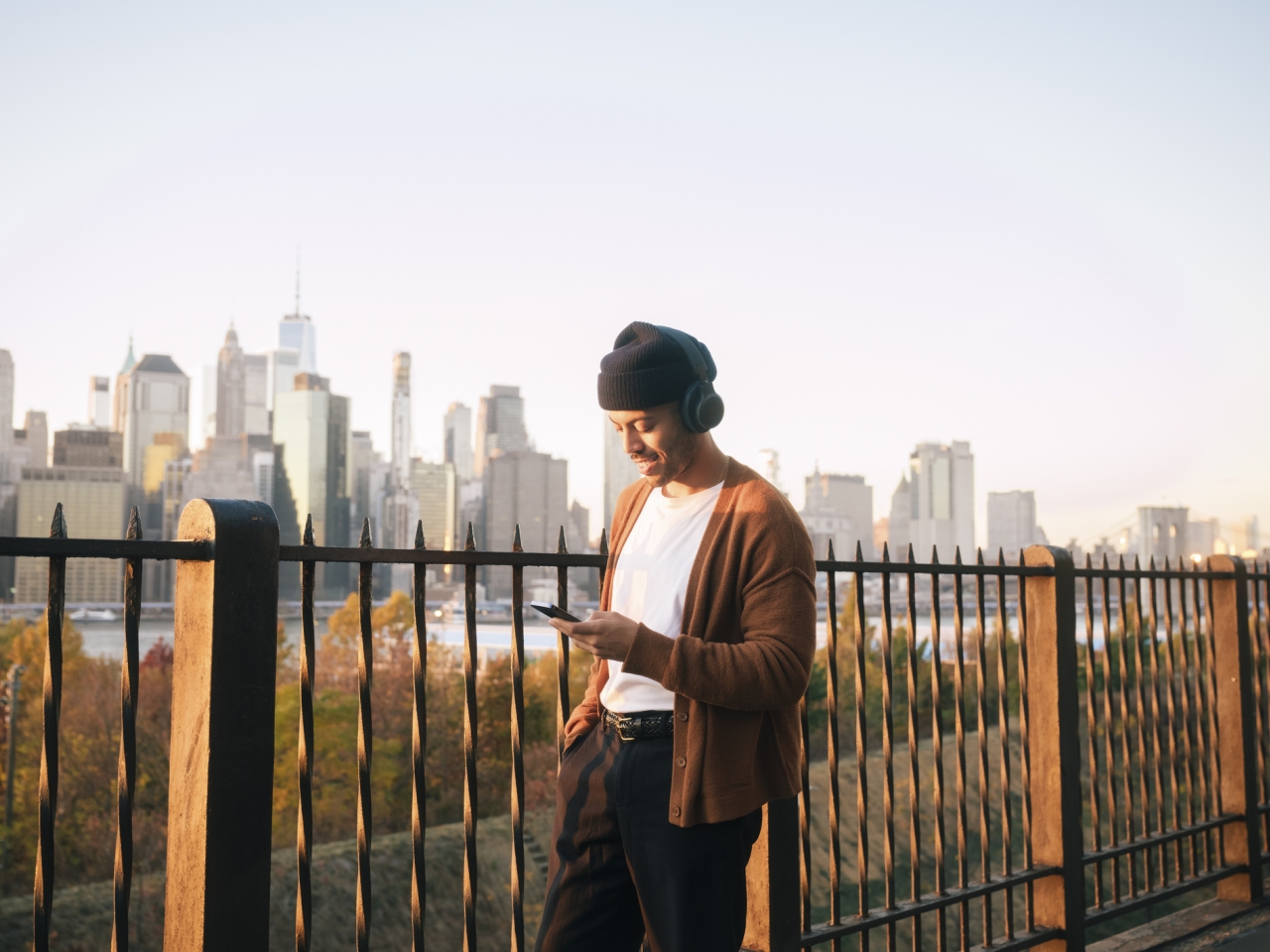 A photo of a man on his phone. 