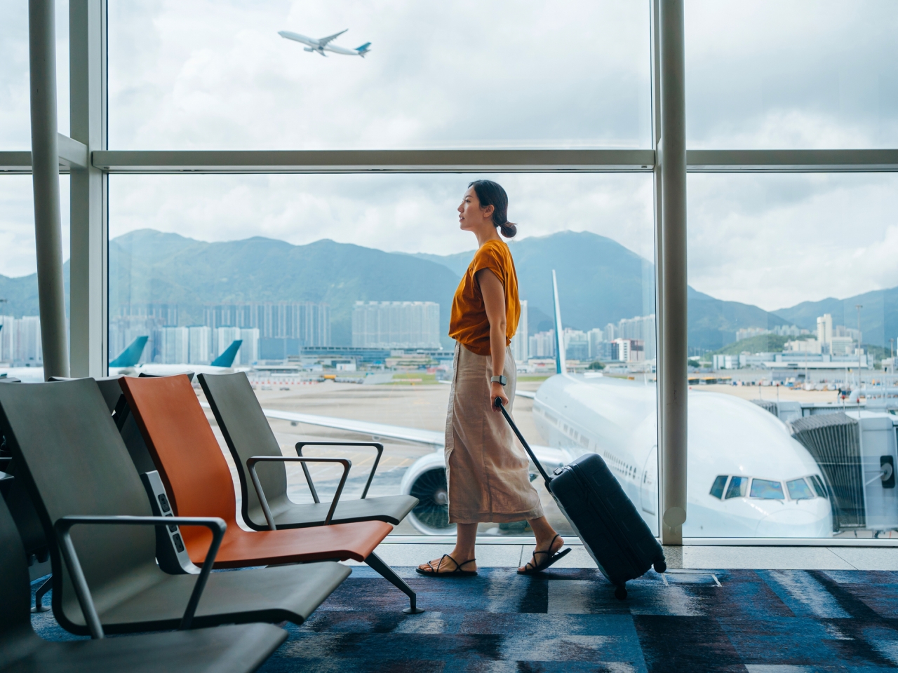 A photo of a traveler in an airport. 