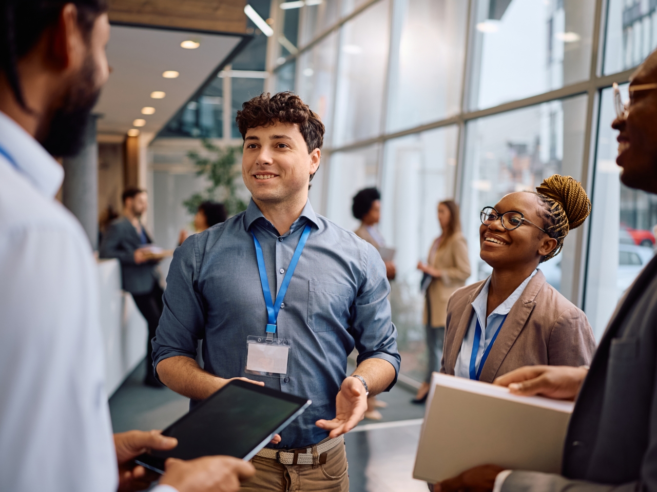 A photo of a smiling man in a business setting. 