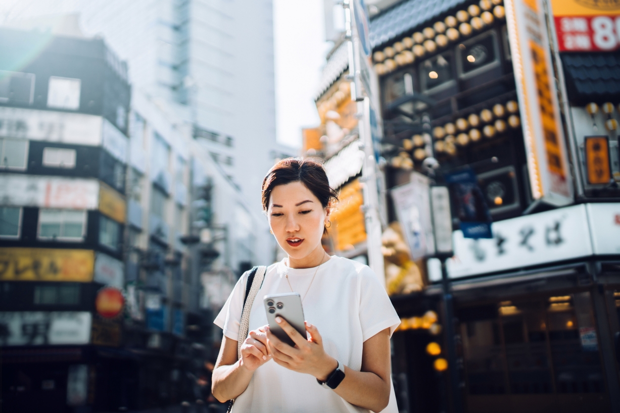 A photo of a traveler on their phone