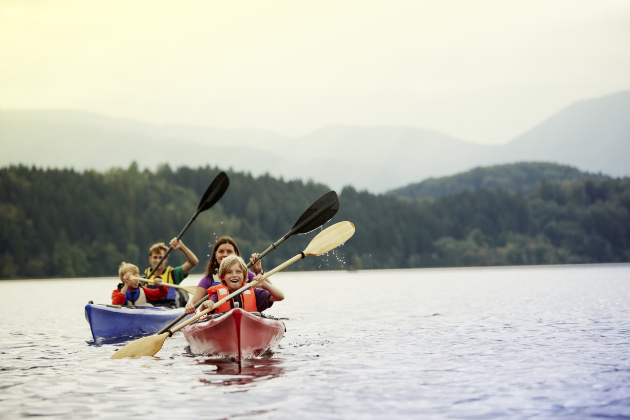 A photo of a family kayaking