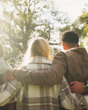 A photo of people holding each other