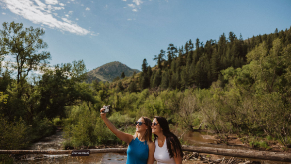 two people taking selfie near mountain