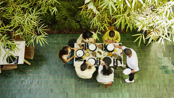 Overhead view of a group of people sharing food at a table