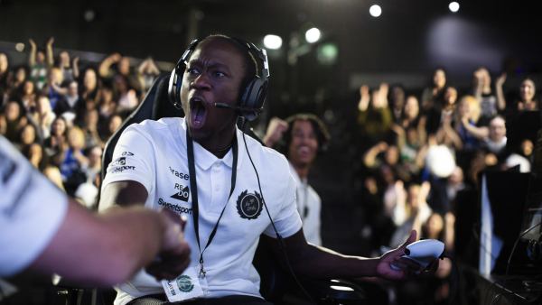 A esports player celebrating a win.