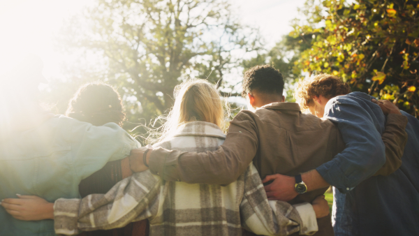 A photo of people holding each other