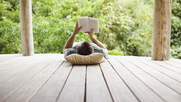 Person reading on a porch