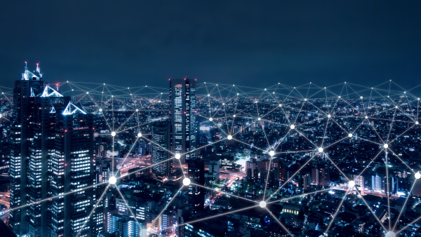 A photo of buildings with telecommunication signals. 