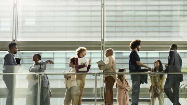 A photo of people meeting at a conference. 