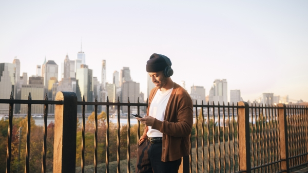 A photo of a man on his phone. 