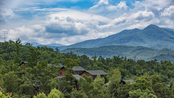 Scenic view of trees and mountains against sky in Gatlinburg. 