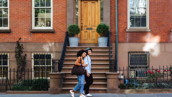 A couple walking down the city.