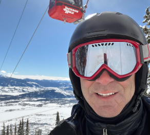 Mitch Knothe wearing ski gear next to the gondola at Jackson Hole, WY