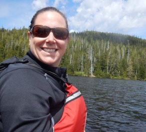 Karin Mast smiling in front of a forest