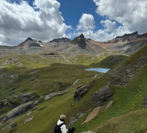 A photo of Shiann in between mountains. 