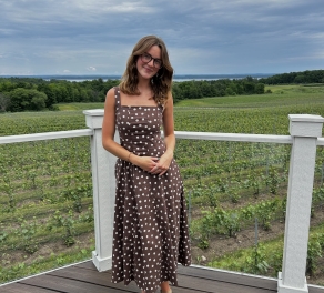 A photo of Taylor on a deck. 