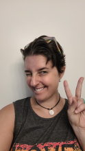 A selfie of Jessica holding up a peace sign. 