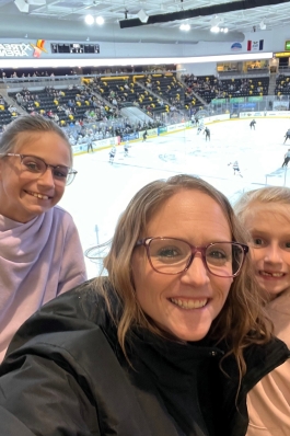 Amanda Steward and her daughters at a hockey game