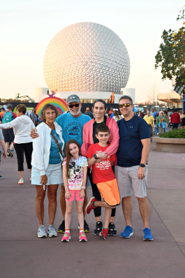Amy Bibbings with family in front of Epcot Center
