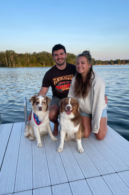 Ben Walton and two dogs on a dock