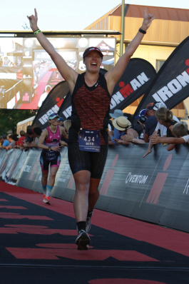 Beth Wright Cheeseman finishing an Ironman race in Idaho