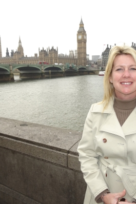 Camron Reid in London with Big Ben and the River Thames in the background
