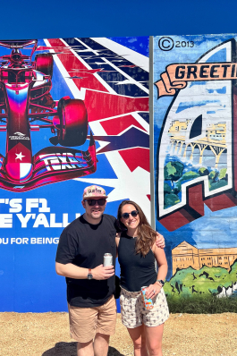 Carrie Tomlinson in front of a mural in Austin, TX