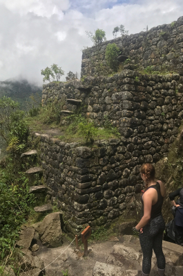 Carson Young observes a stairwell on the Inca Train in Peru