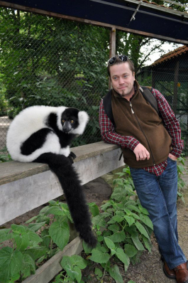 Chris Fjelde with a black and white ruffed lemur
