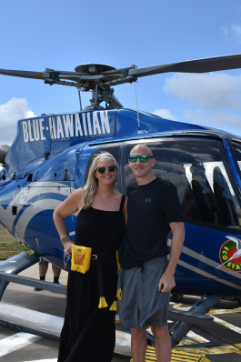 Christine Johnson in front of a helicopter in Kauai