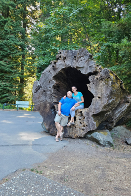 Cynthia Kendrick in front of a very large felled tree