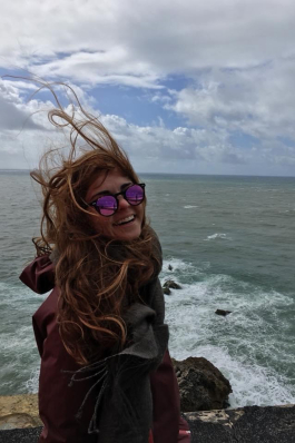 Dana Behnfield on a coastal cliff in Portugal
