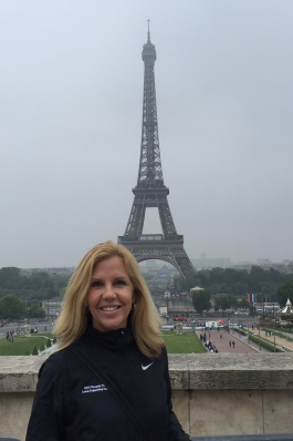 Debbie Johnson in front of the Eiffel Tower in Paris