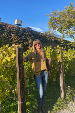 Debra Jones stands in a vineyard in Sonoma, CA