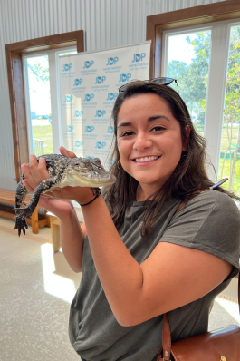 Isa Rubiano holds a juvenile alligator in Louisiana