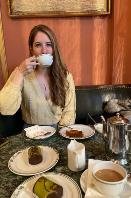 Jamie Fiedler sips coffee in Copenhagen