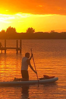 Jeff Coopes paddleboards in Spanish Point, FL