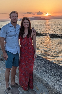 Kelli Chiri and the sunset on a seawall in Greece