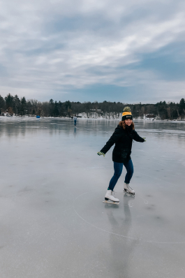 Melissa Juneau ice skating on a lake in Wisconsin