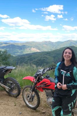 Miranda Maisto with dirt bikes on Utah