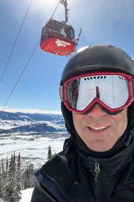 Mitch Knothe wearing ski gear next to the gondola at Jackson Hole, WY