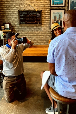 Neal Alfano photographs an interview in Sarasota